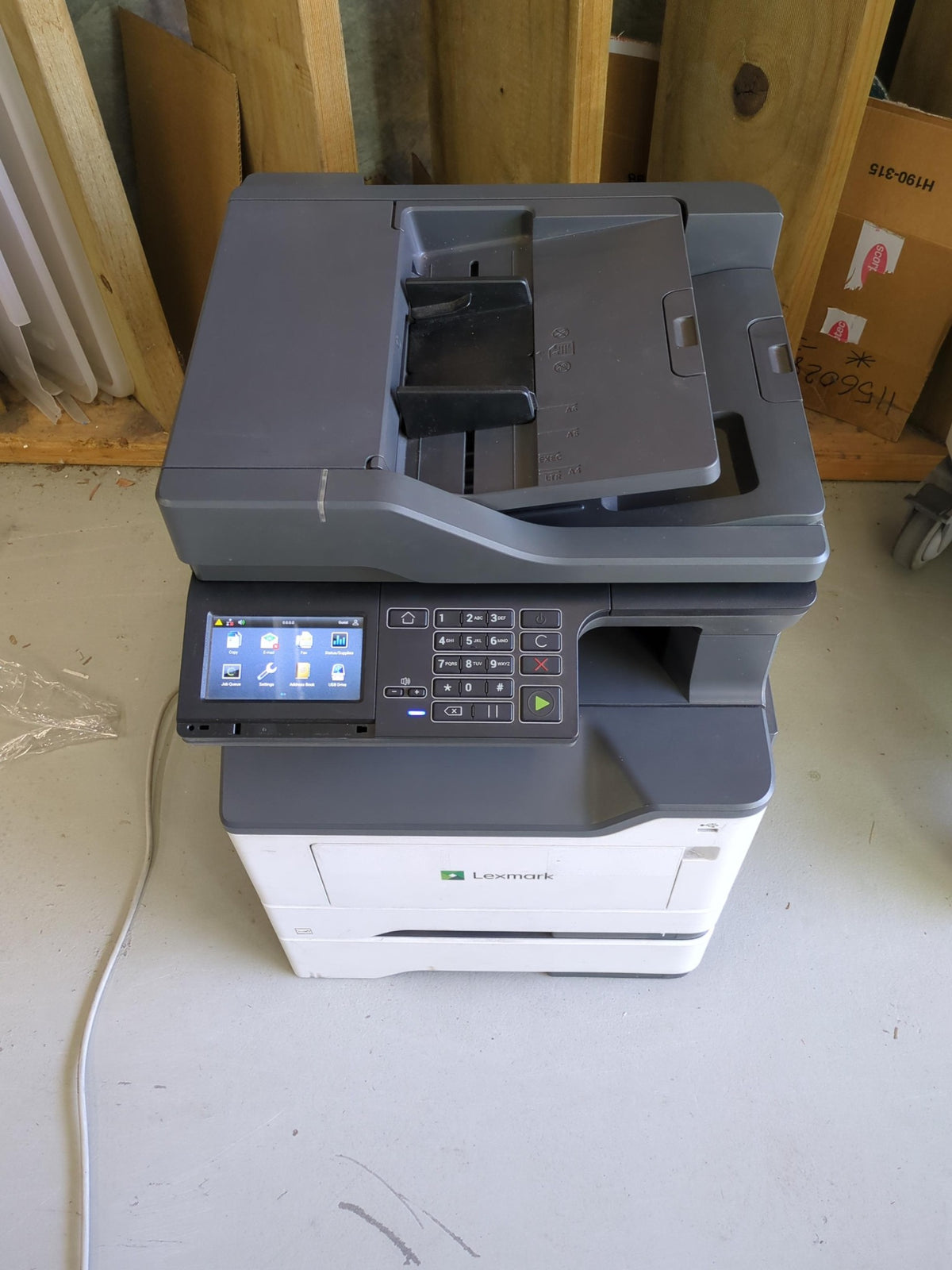 Used Lexmark MX421ade unit with 76,217 pages - front view, model badge missing